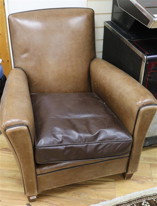 A pair of leather club armchairs